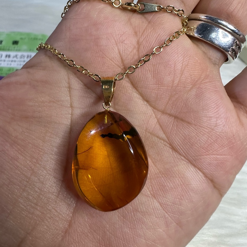 AMBER necklace in 18k gold and plated chain - Picture 10 of 17